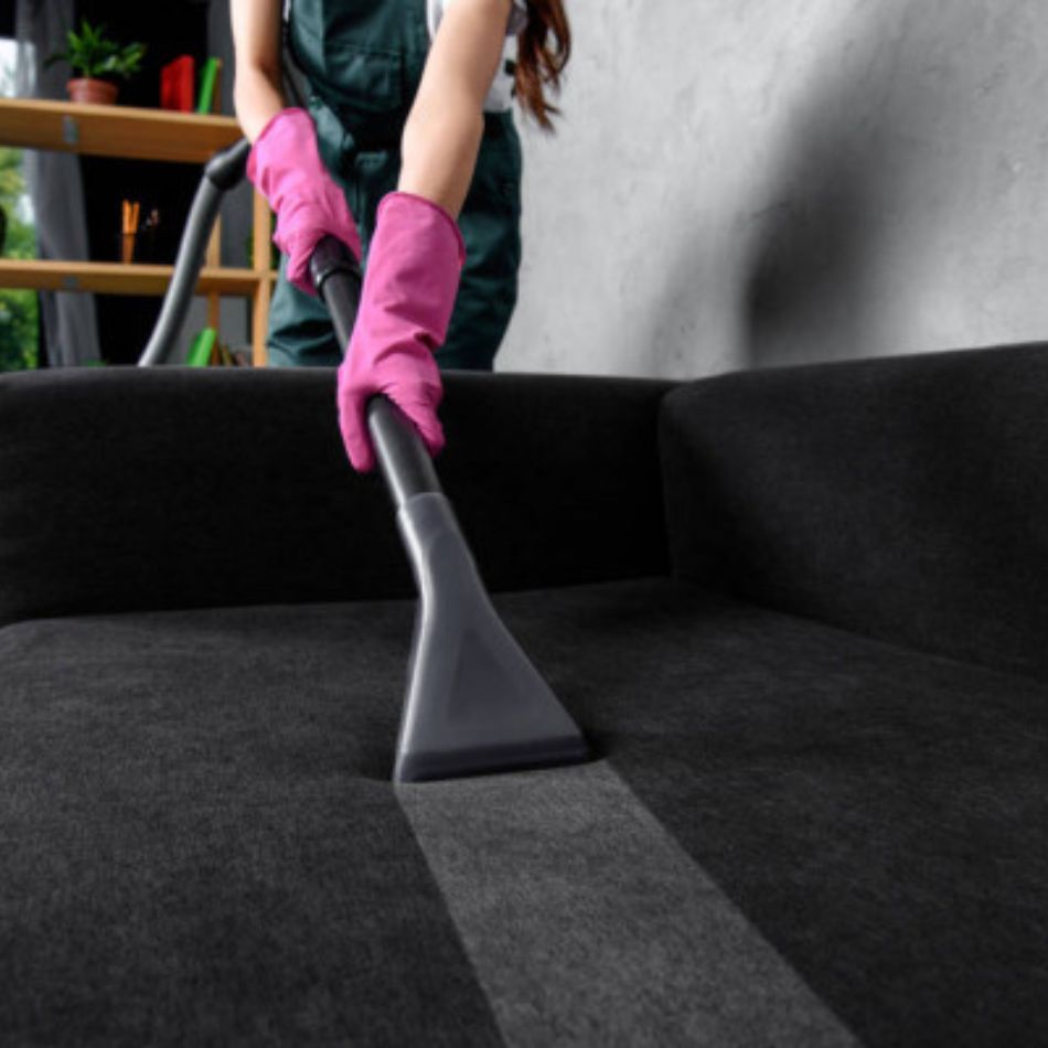 Professional sofa and upholstery cleaning service in Sydney using steam cleaning machine to remove dirt and stains from fabric sofa